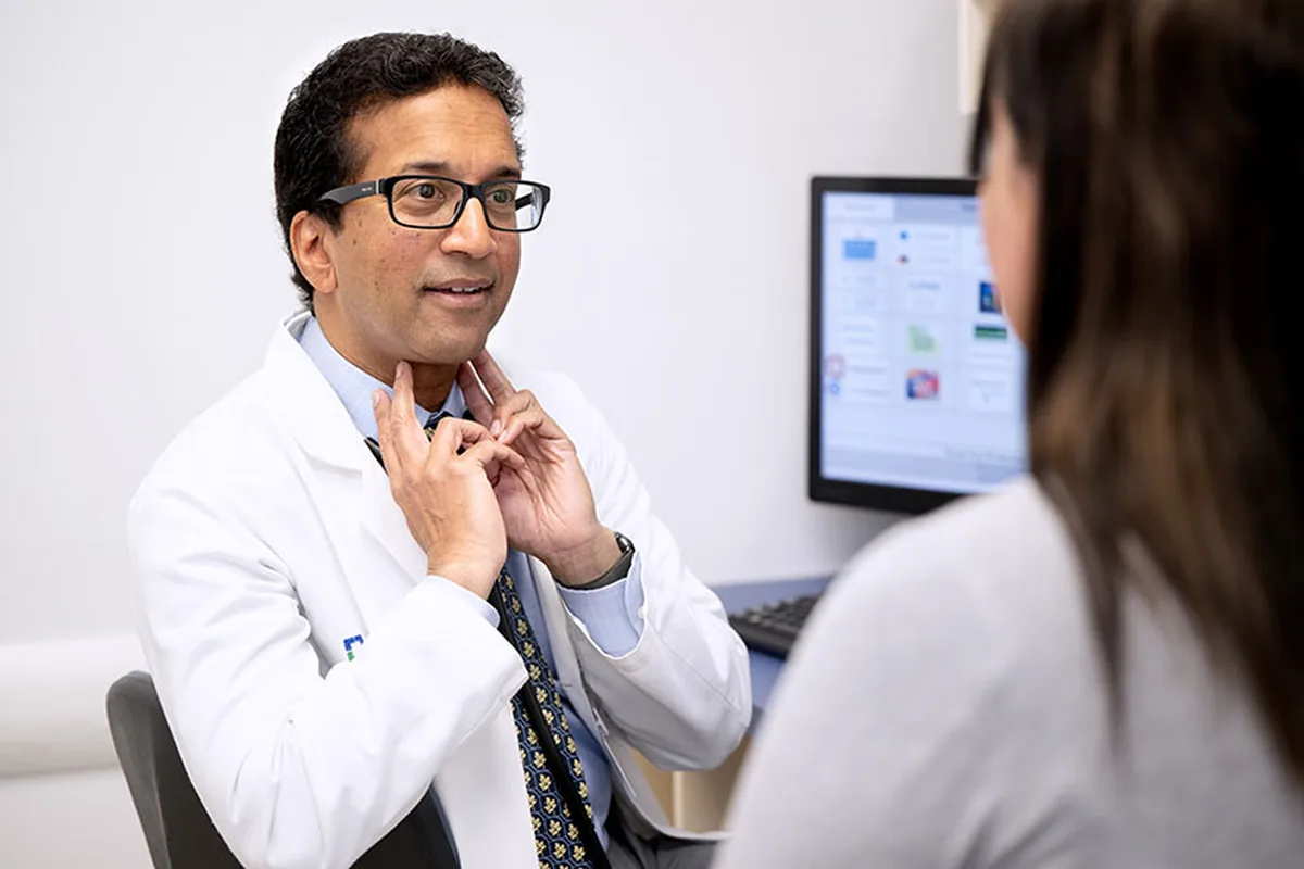 A doctor talking with a patient in a consulting room